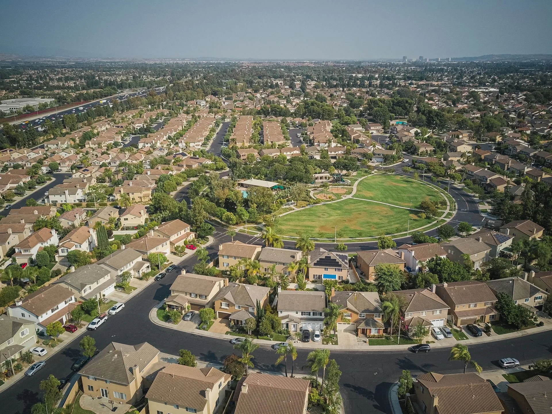 Aerial view of a residential neighborhood arranged around a central park